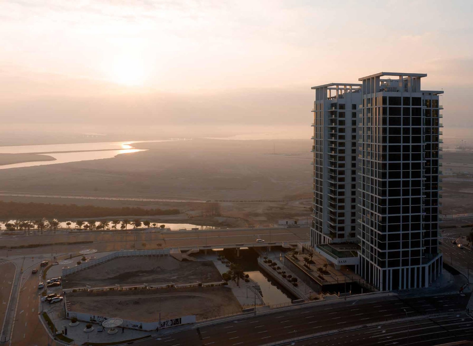 Stunning exterior view of Reem Nine by SAAS Properties showcasing modern luxury waterfront apartments on Al Reem Island, Abu Dhabi.