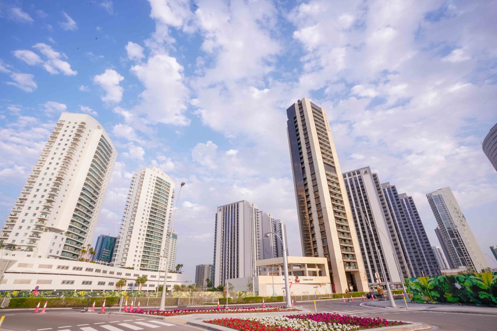 Aerial view of Amaya Towers, Al Reem Island, Abu Dhabi, displaying twin 25-storey towers and surrounding waterfront location.