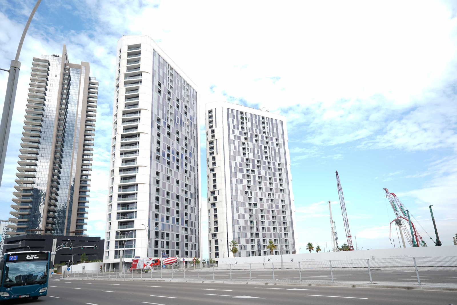 Exterior view of Meera Shams Abu Dhabi towers on Al Reem Island, showcasing modern luxury apartments and landscaped gardens